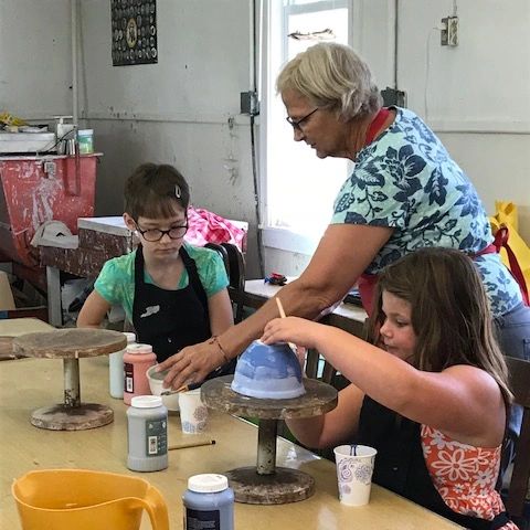 Ceramic artist Cindy Cooperider working with students in the Somerset Artists' Co-op Studio.