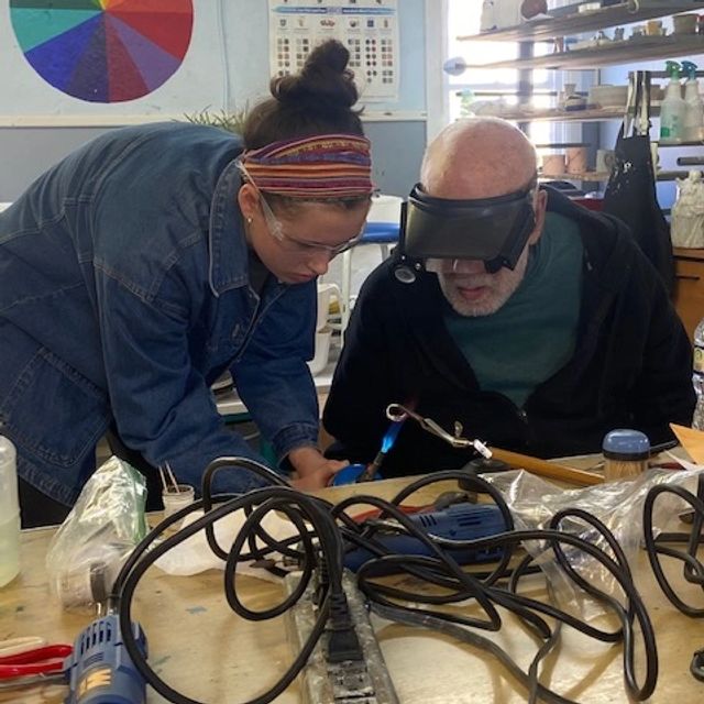 Silversmithing artist David Kunkler working with a student at the Somerset Artists' Co-op.