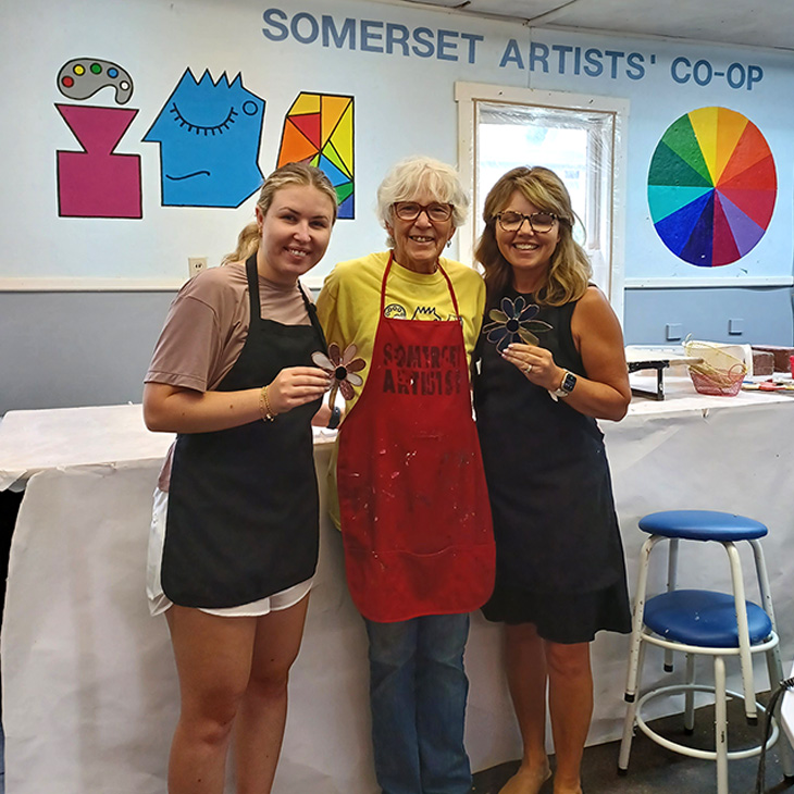 Jane Kunkler with two stained glass students in the studio at the Somerset Artists' Co-Op in Somerset, Ohio.