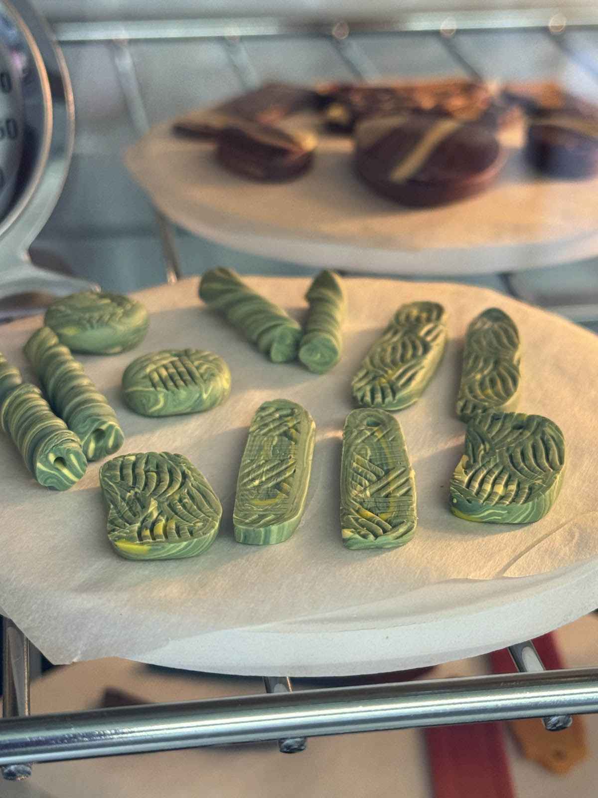 Student polymer clay pieces curing in the oven at the Somerset Artists Co-Op.