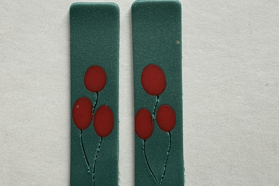 Polymer clay earrings with embedded color prior to baking.