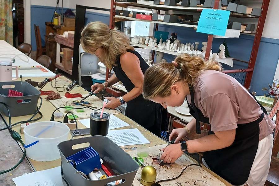 Student creating a Tiffany-style stained glass piece at the Somerset Artists' Co-Op in Somerset, Ohio.