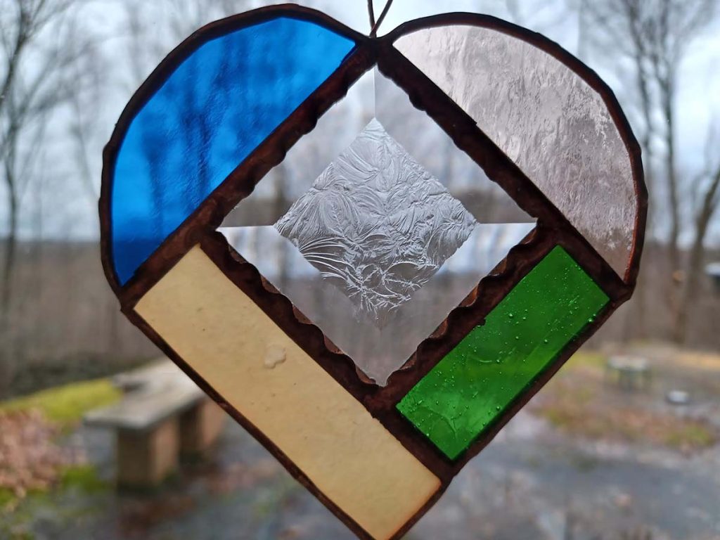 Stained Glass heart in winter window.